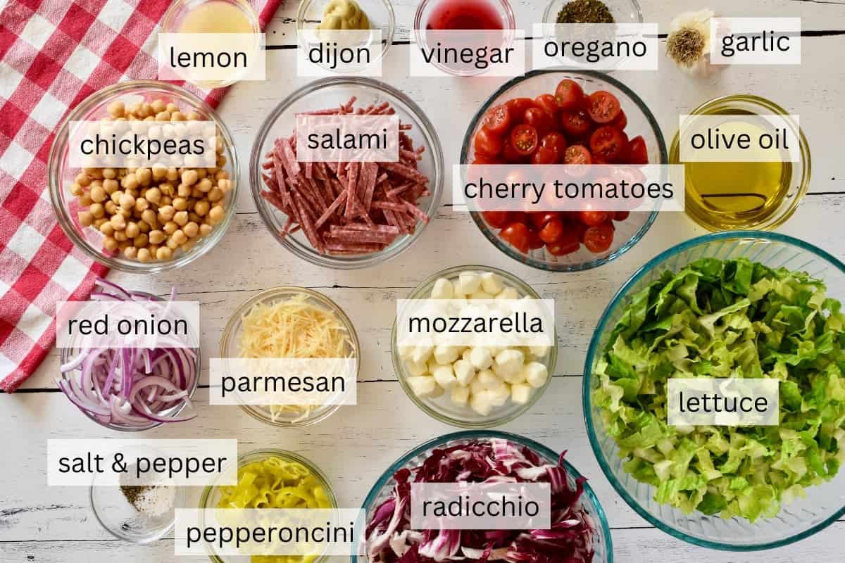 Ingredients for recipe include mozzarella, romaine lettuce, salami, pepperoncini, chickpeas, and cherry tomatoes.