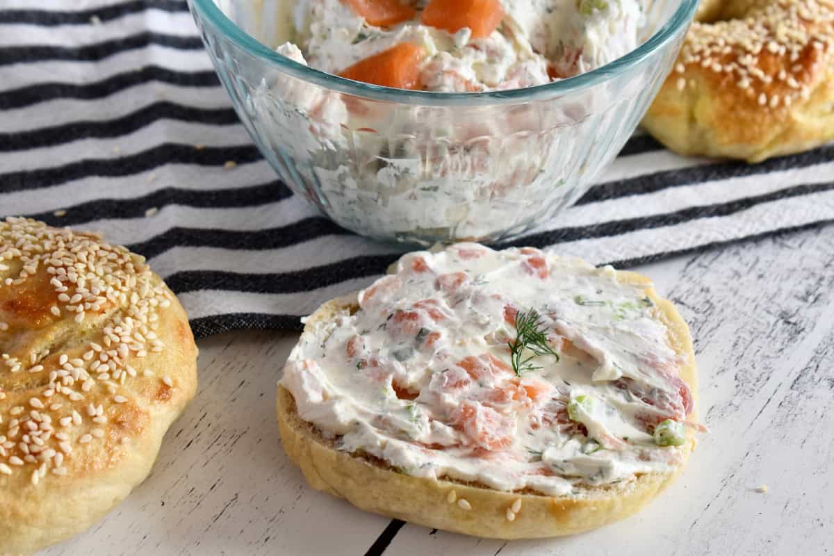Smoked salmon cream cheese spread on top of a bagel.