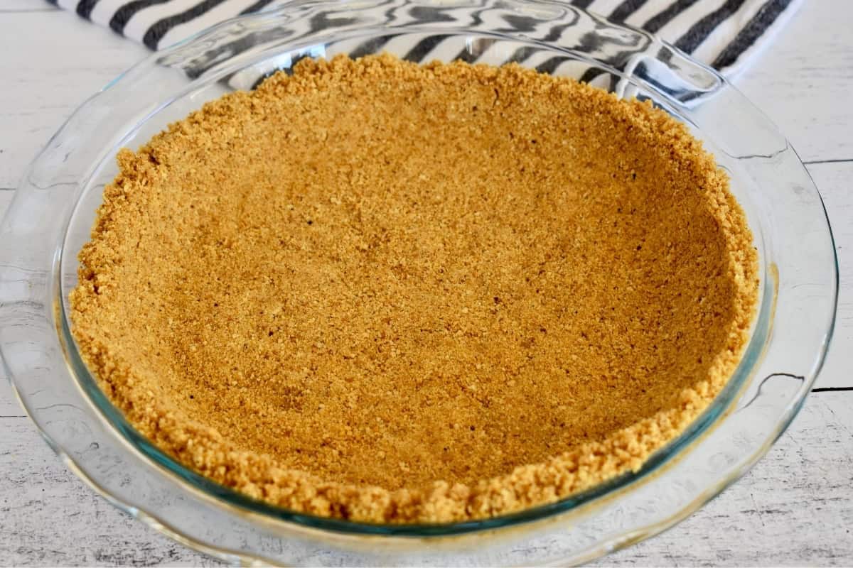 Graham Cracker Crust in a glass pie plate. 