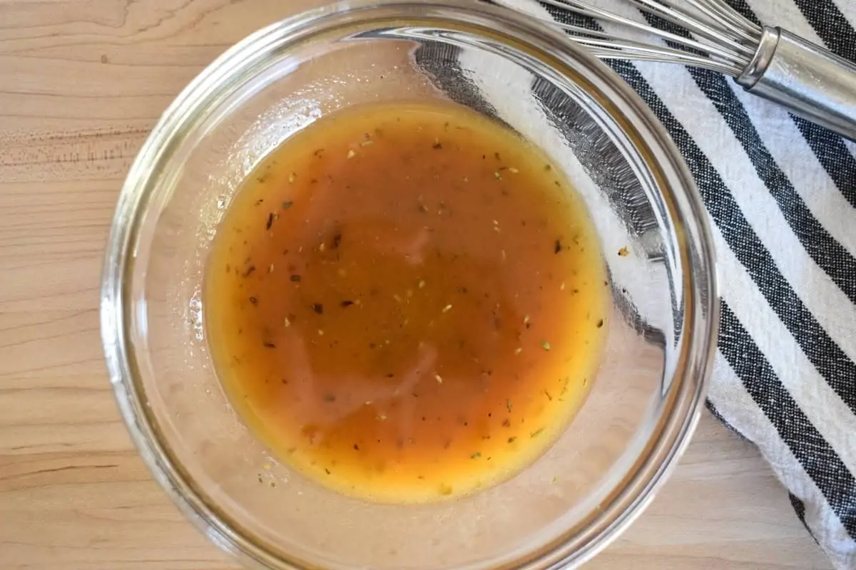 Vinaigrette dressing in a glass bowl.