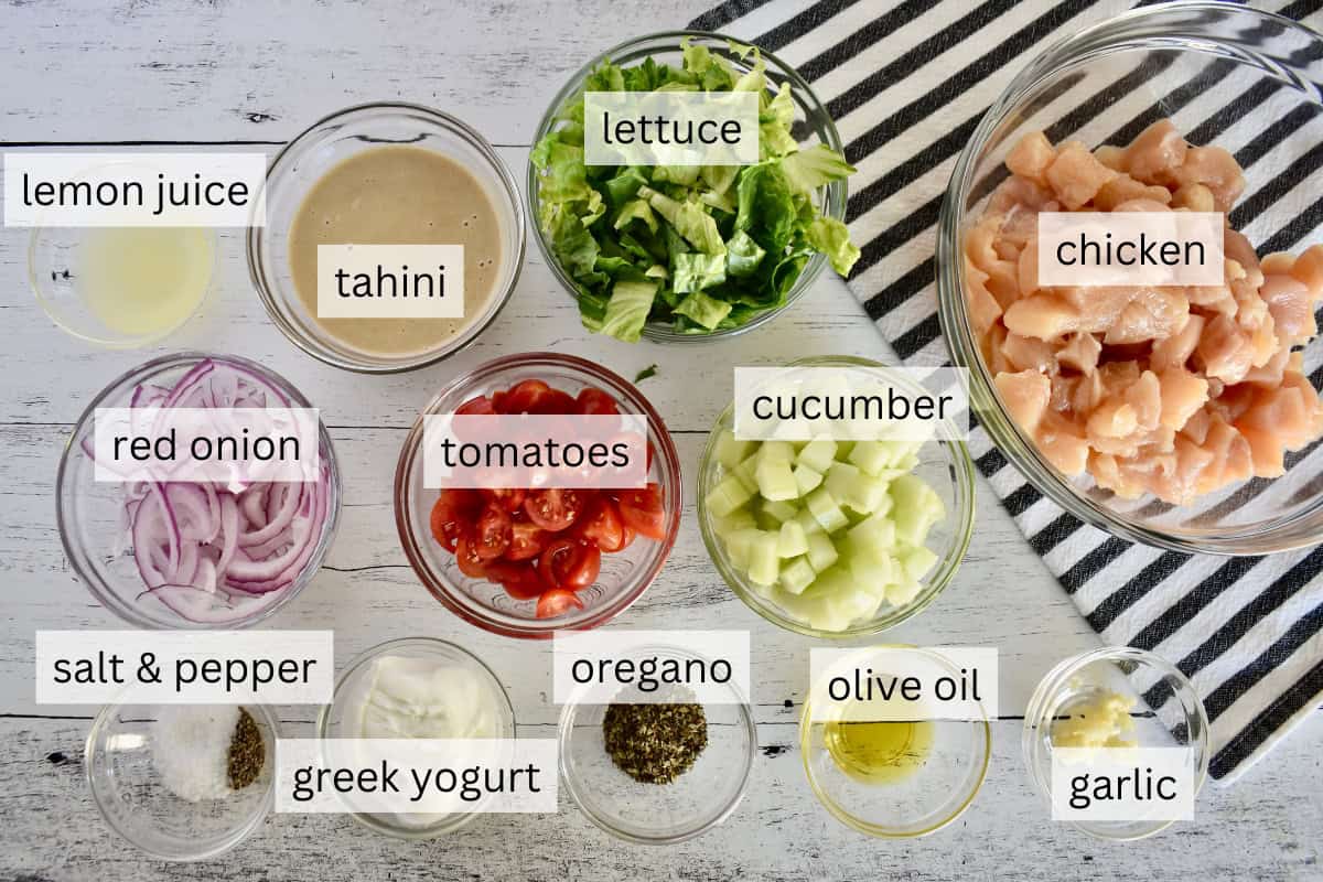 Ingredients include cucumbers, tomatoes, oregano, and tahini.