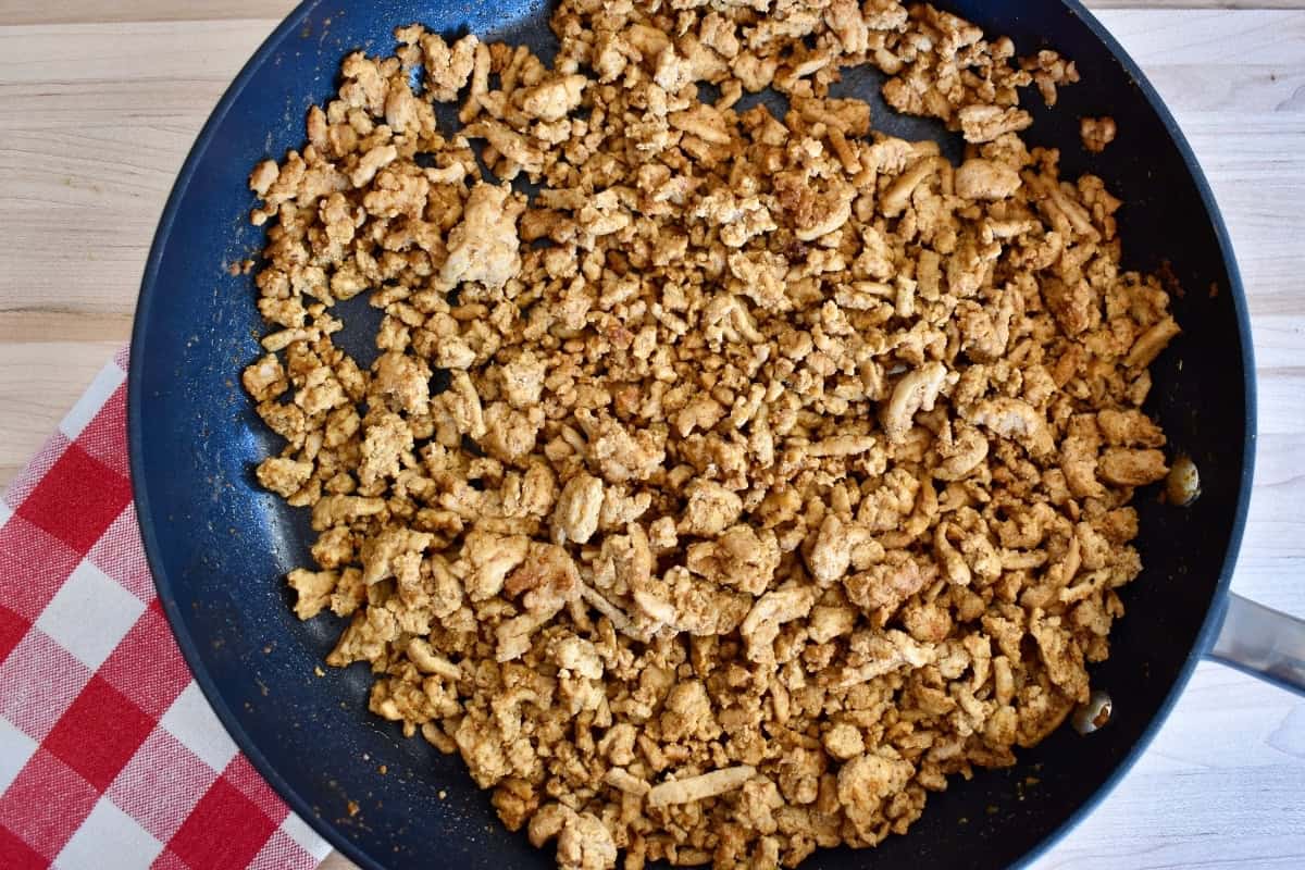 Cooked seasoning meat in a large nonstick skillet.