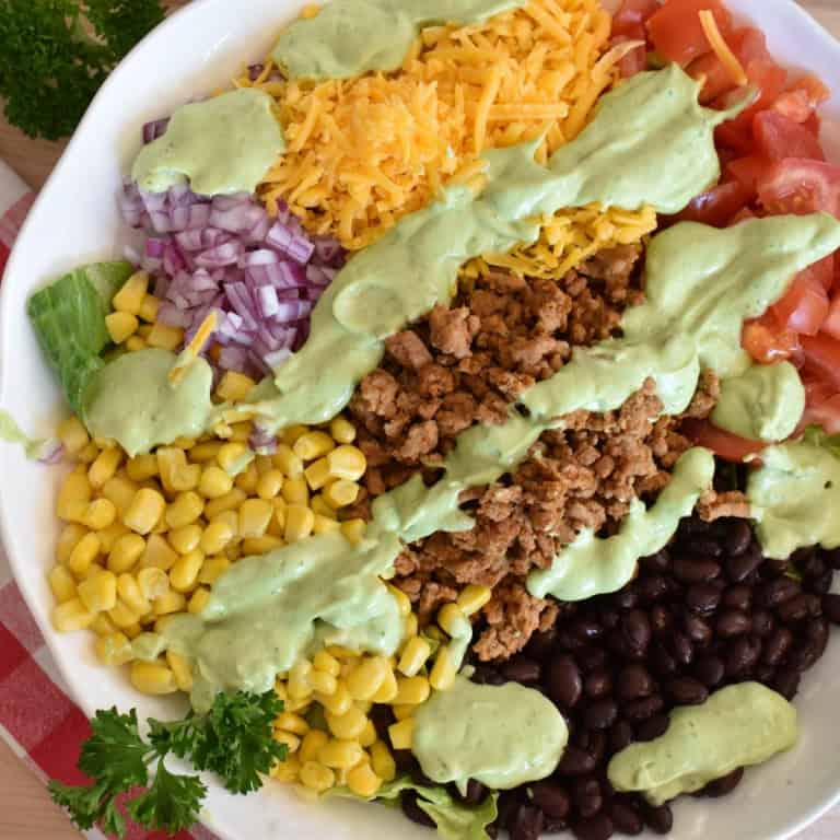 Ground Turkey Taco salad with avocado dressing.