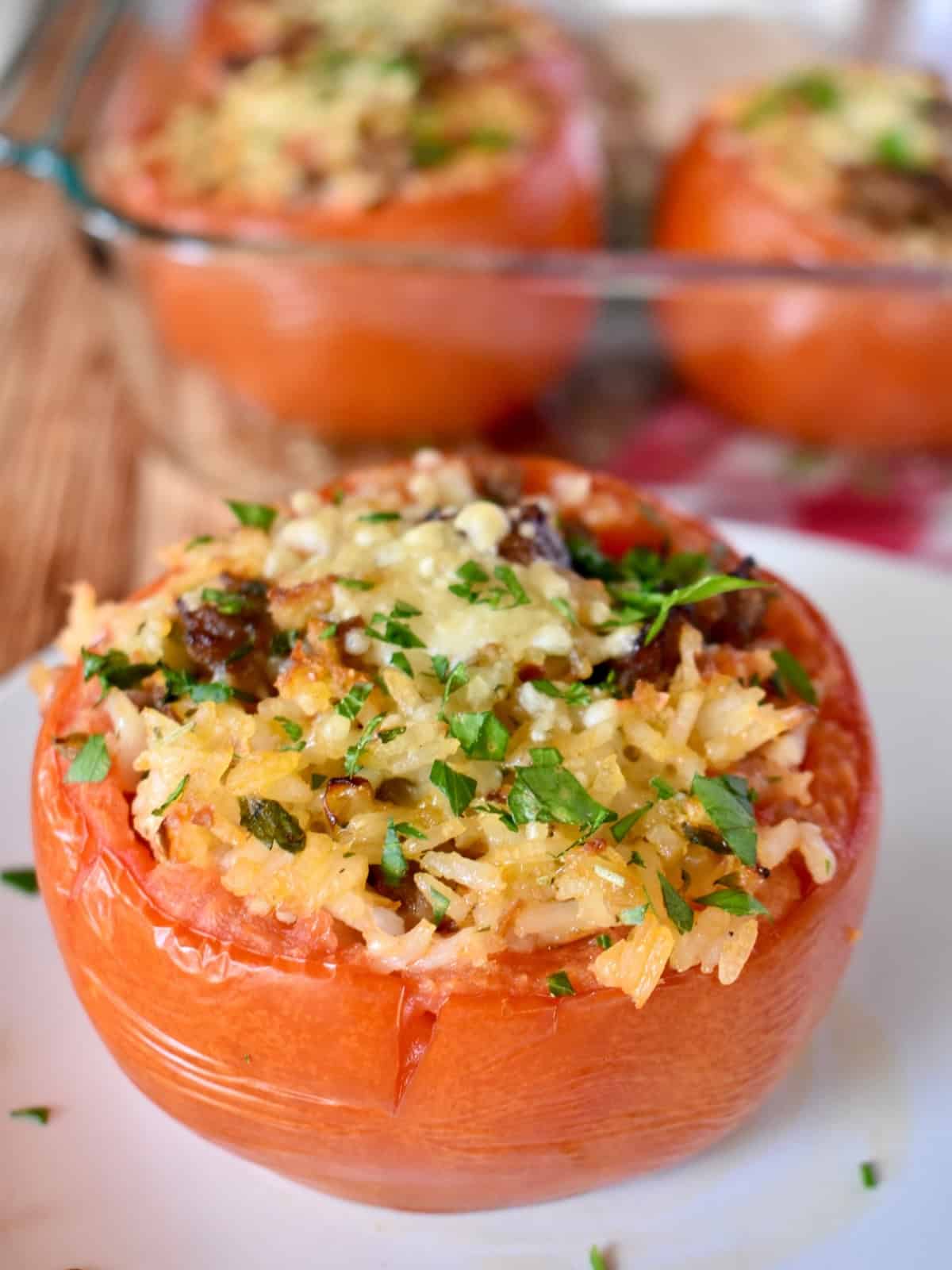 Baked Stuffed Tomatoes on a white plate.