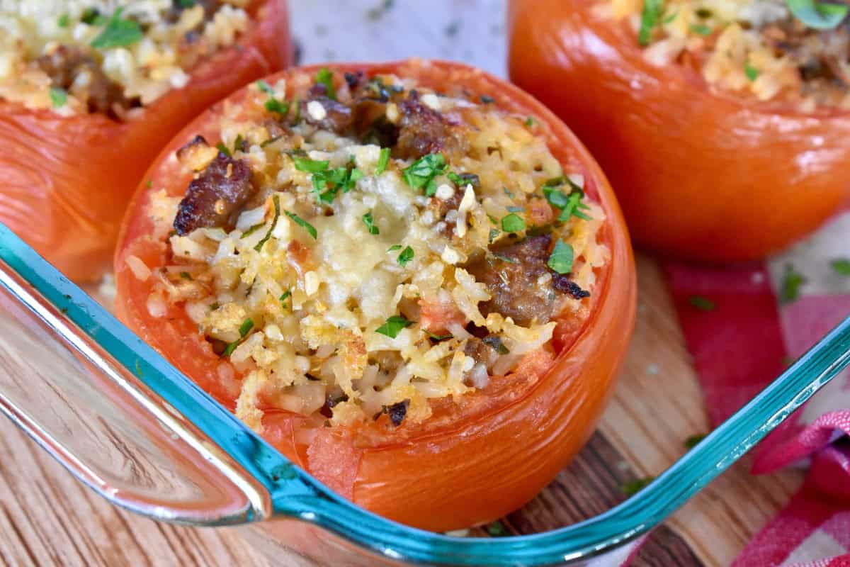Baked Stuffed Tomatoes in a glass baking dish.