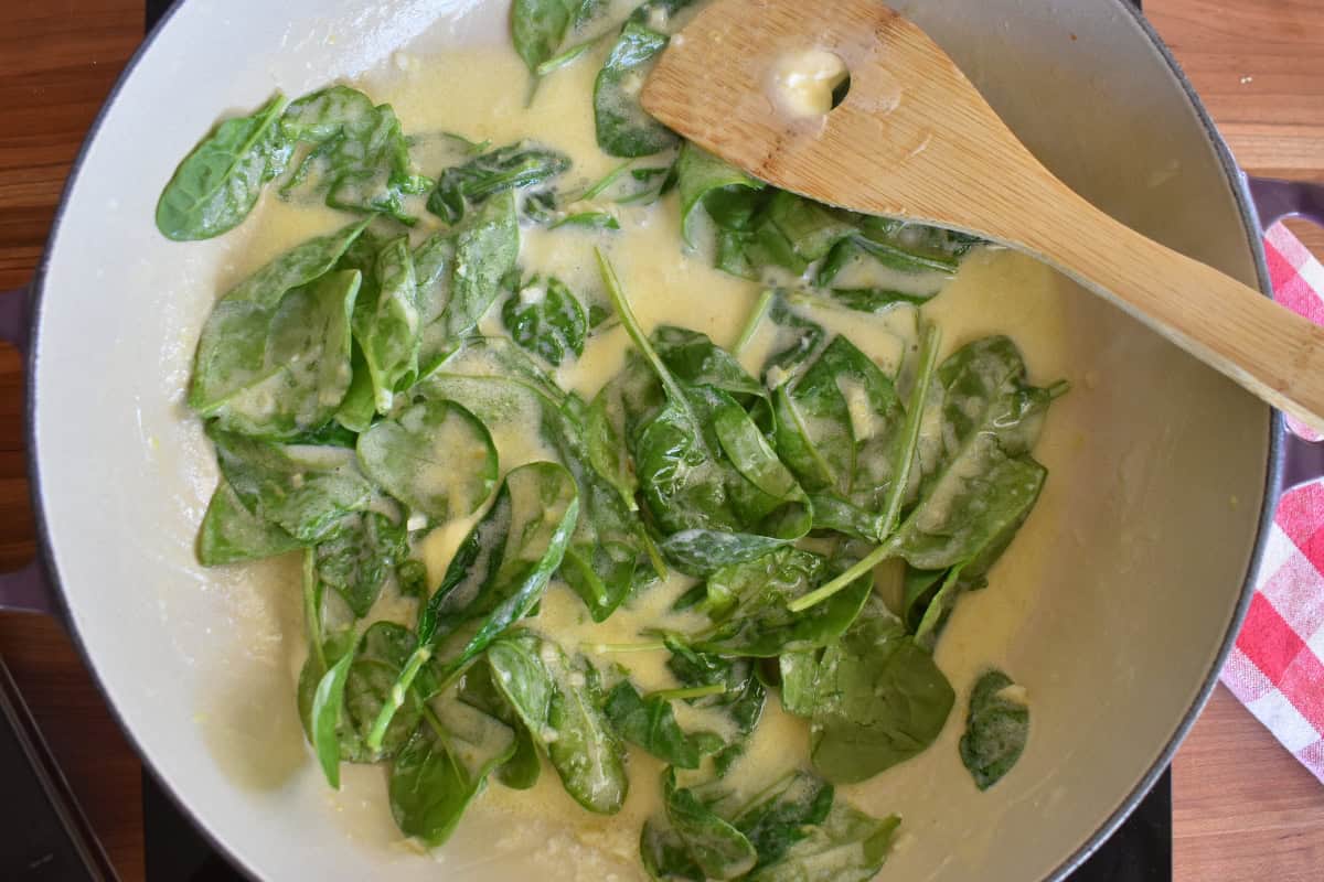 Spinach and cheese added to the skillet with the sauce. 