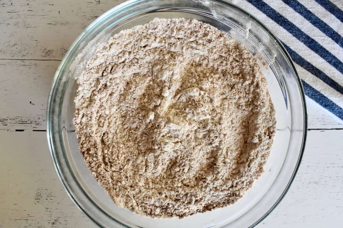 Dry ingredients mixed together in a glass bowl. 