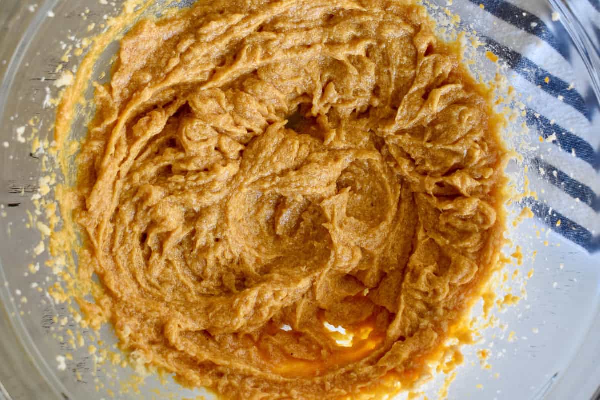 Wet ingredients mixed together in a glass bowl. 