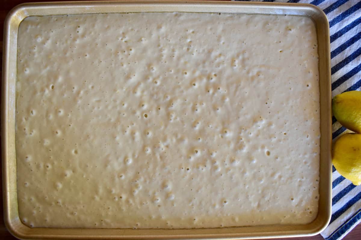 Pancake batter spread into a half sheet pan.