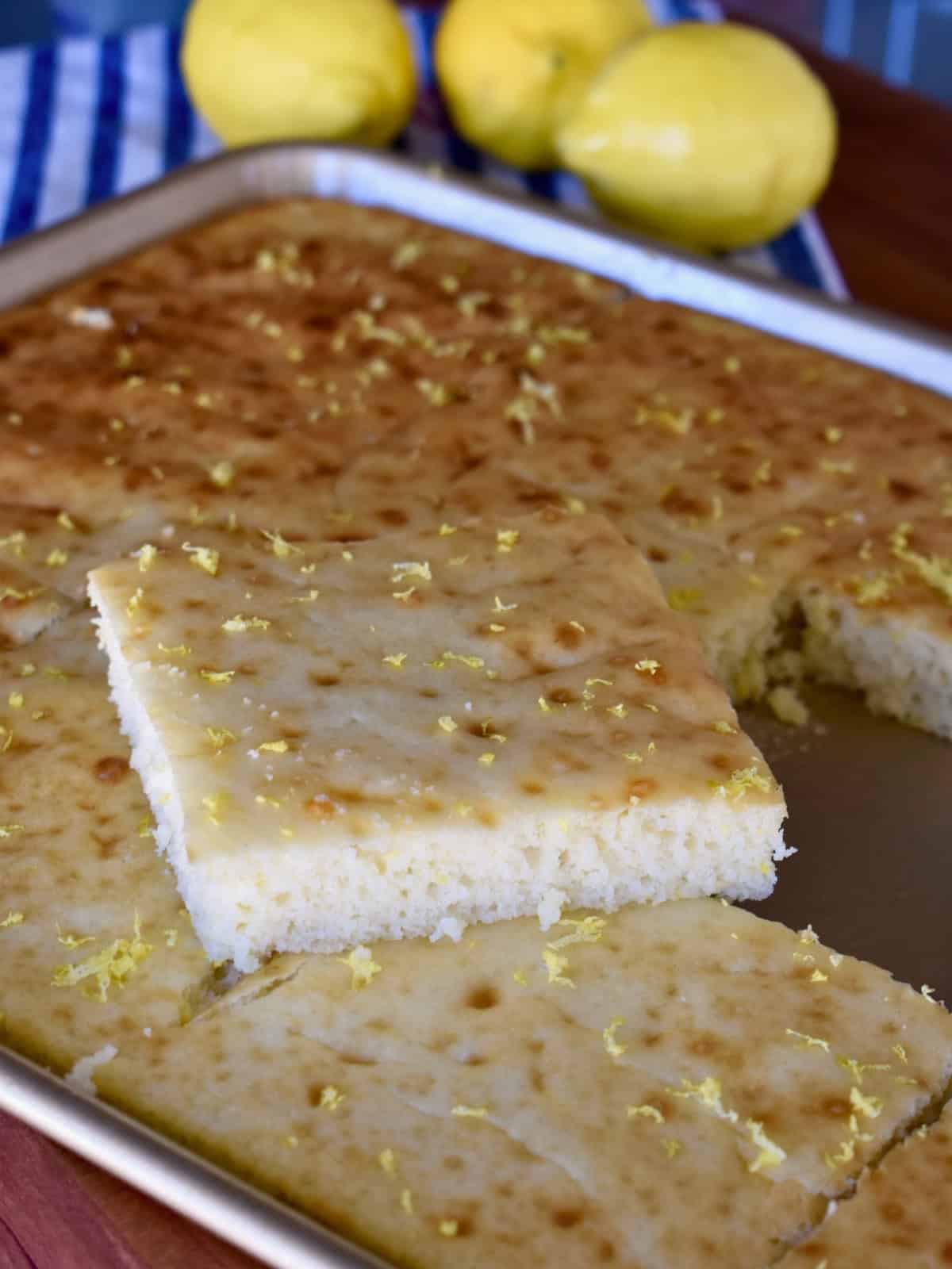 Sheet Pan Lemon Ricotta Pancakes in a half sheet pan cut into squares.